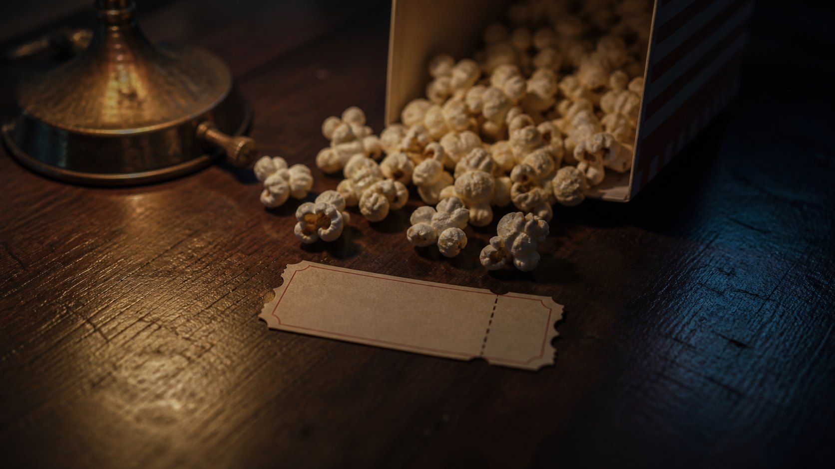 A generic 1950s movie ticket stub and spilled popcorn on a dark wooden table, representing the Grimes sisters theater trip.