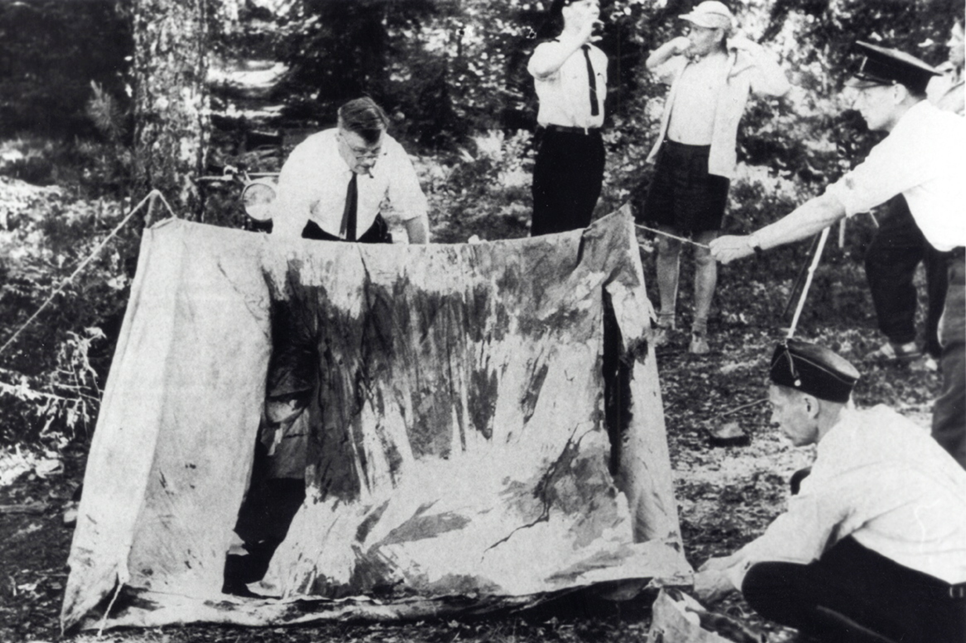 Public-domain 1960 archival image of investigators examining the torn tent in the Lake Bodom murders.