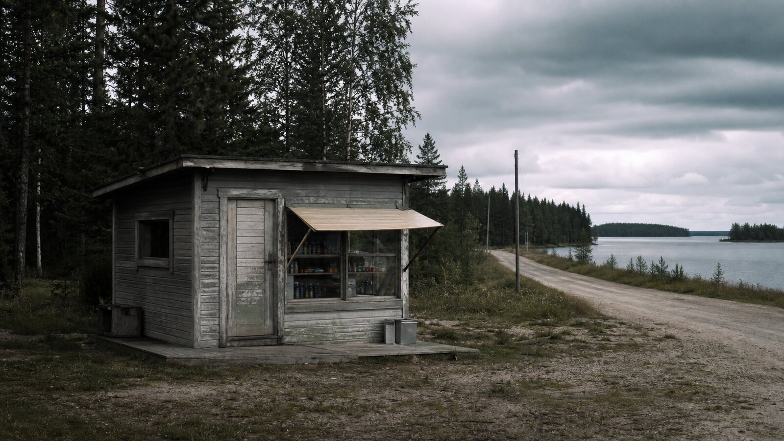 A weathered roadside kiosk near a Finnish lake road, representing the suspect lore around Karl Valdemar Gyllström in the Lake Bodom murders.