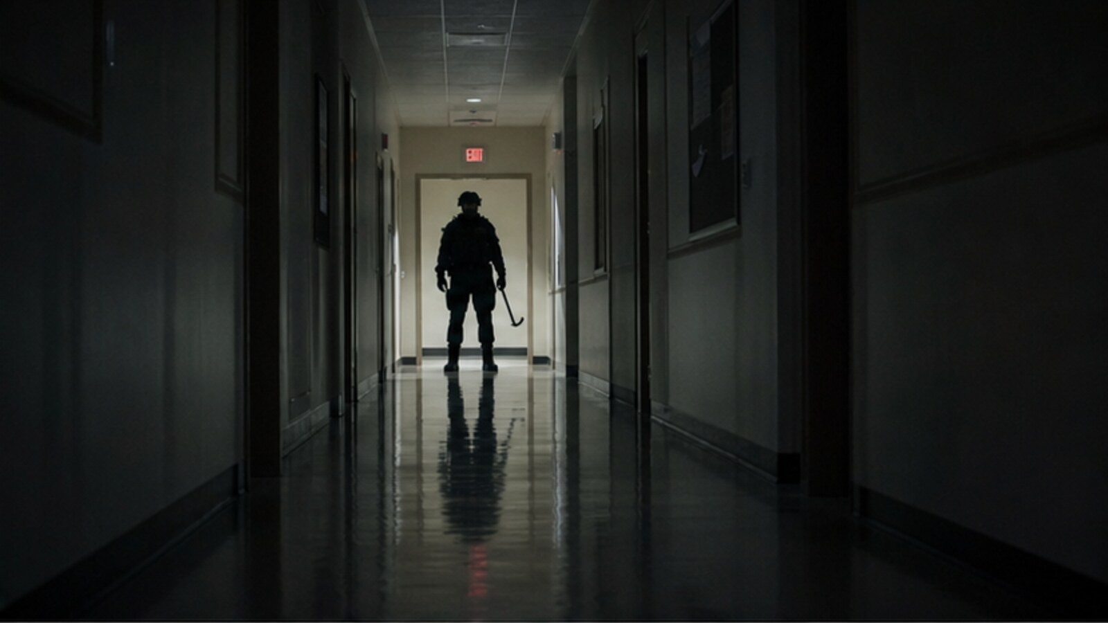 A dim church hallway with an indistinct figure in police-style tactical gear, representing the unrevealed identity in the Missy Bevers case.