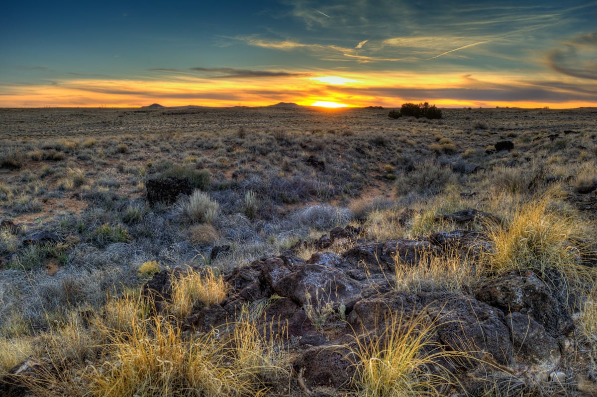 Wikimedia Commons photograph of the Albuquerque West Mesa landscape at sunset.