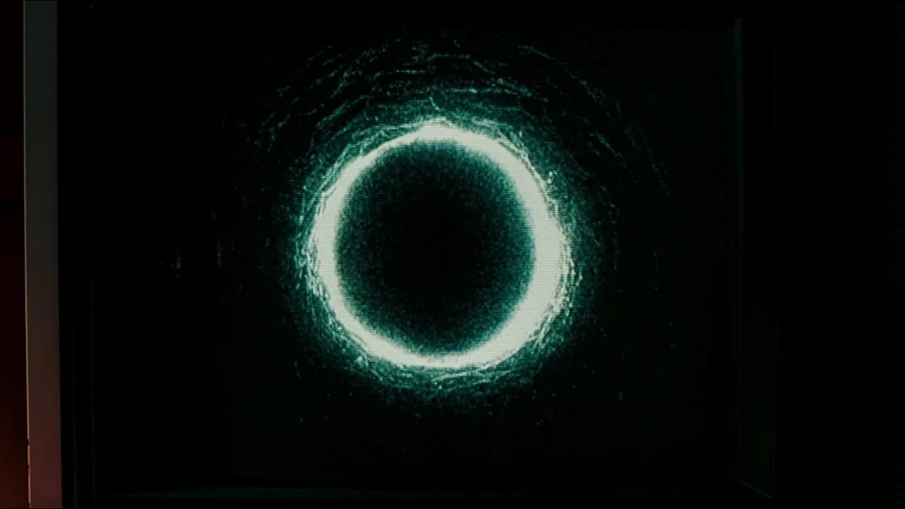 The glowing ring appears on a television screen during Rachel Keller's viewing of the cursed tape.