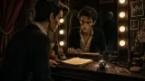 Guy Woodhouse stares into a backstage dressing room mirror while Roman Castevet waits in the reflection and a silver charm ball smolders on the vanity.