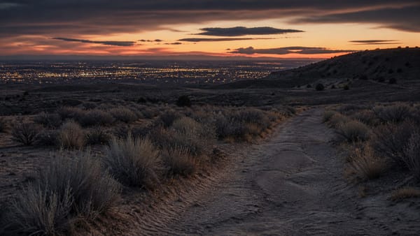 A desolate Albuquerque West Mesa desert trail at dusk, representing the unsolved West Mesa murders.